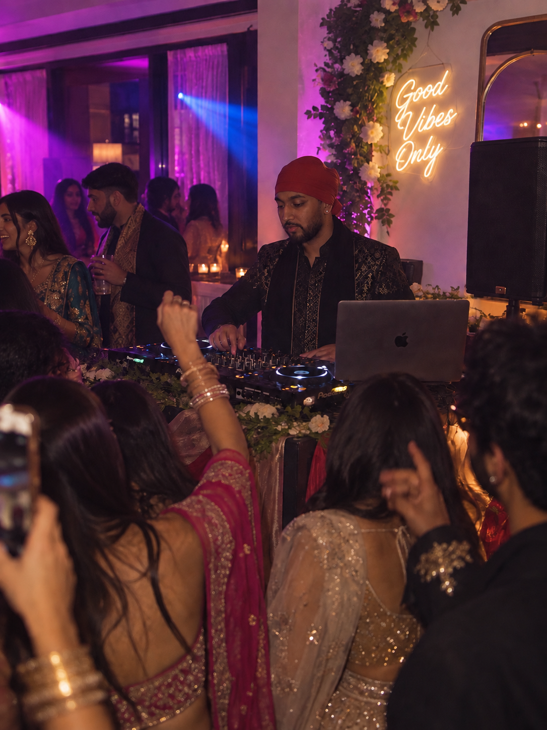 DJ Bawa mixing under the Good Vibes Only sign